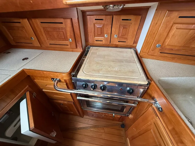 Slide: The Image of Wooden kitchen interior of 2012 Tartan 4000 yacht with stove and cabinetry. - 40