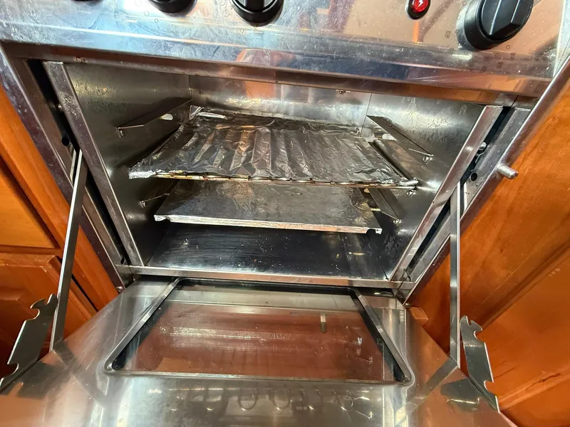 Slide: The Image of Open Tartan 4000 oven, stainless steel interior, showing racks and control knobs, 2012 model. - 41