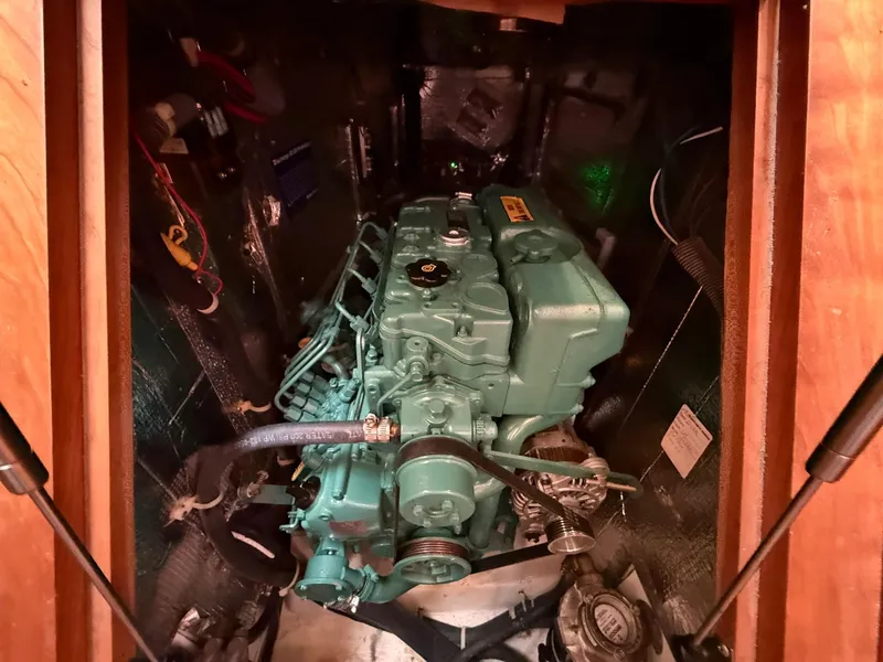 Slide: The Image of Engine compartment of a 2012 Tartan 4000 sailboat, showcasing a well-maintained marine engine. - 45