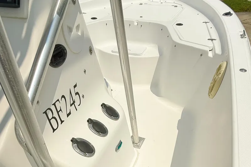 Slide: The Image of 2005 Sea Fox 245 Bay Fisher boat interior with seating and rod holders. - 10