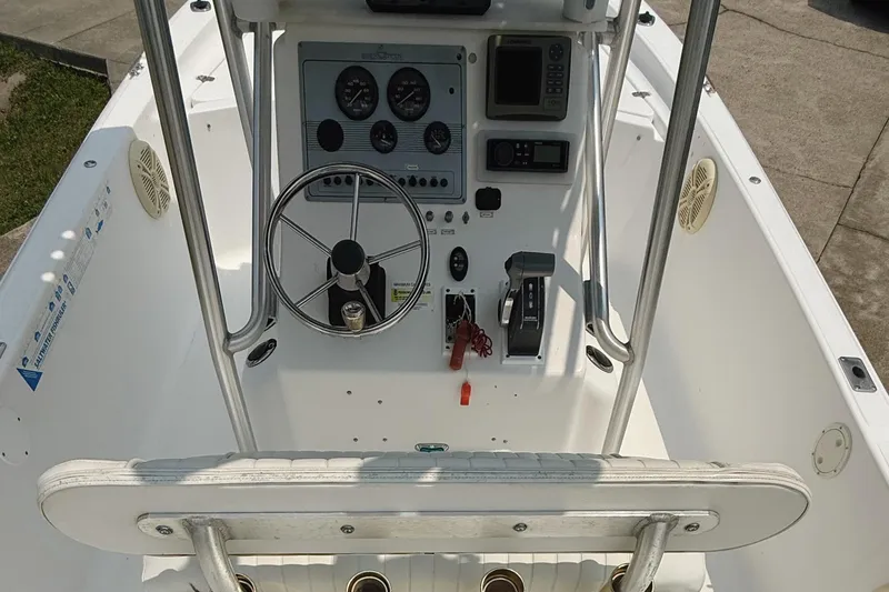 Slide: The Image of 2005 Sea Fox 245 Bay Fisher boat console with steering wheel and controls. - 11