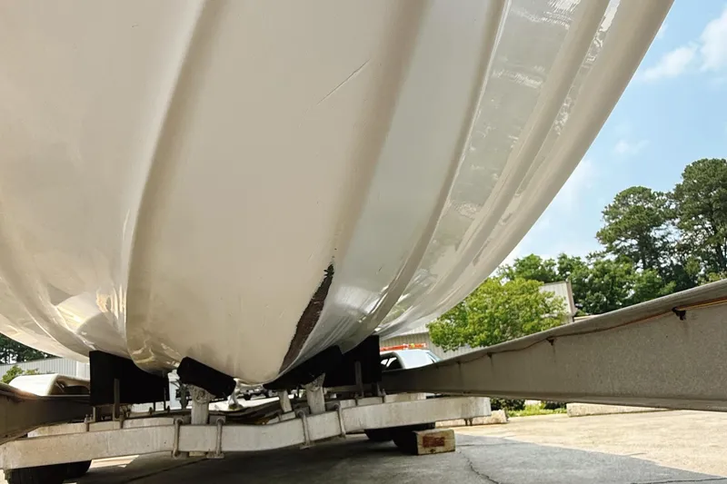 Slide: The Image of 2005 Sea Fox 245 Bay Fisher boat hull on trailer, showing underside details. - 13