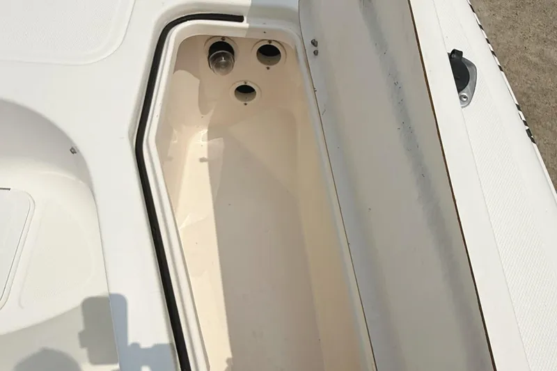 Slide: The Image of Open storage compartment on a 2005 Sea Fox 245 Bay Fisher boat. - 15