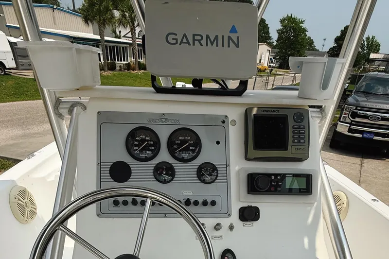 Slide: The Image of Console of a 2005 Sea Fox 245 Bay Fisher with Garmin and Lowrance electronics. - 17