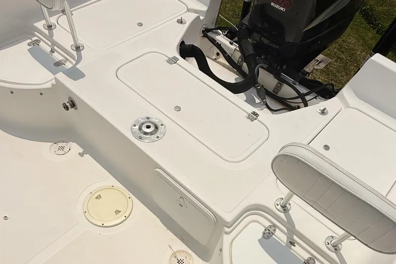 Slide: The Image of 2005 Sea Fox 245 Bay Fisher boat deck with seating and motor. - 18