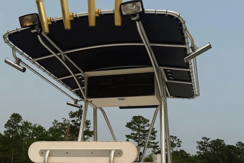 Slide: The Image of T-top of 2005 Sea Fox 245 Bay Fisher boat with rod holders and lights. - 19