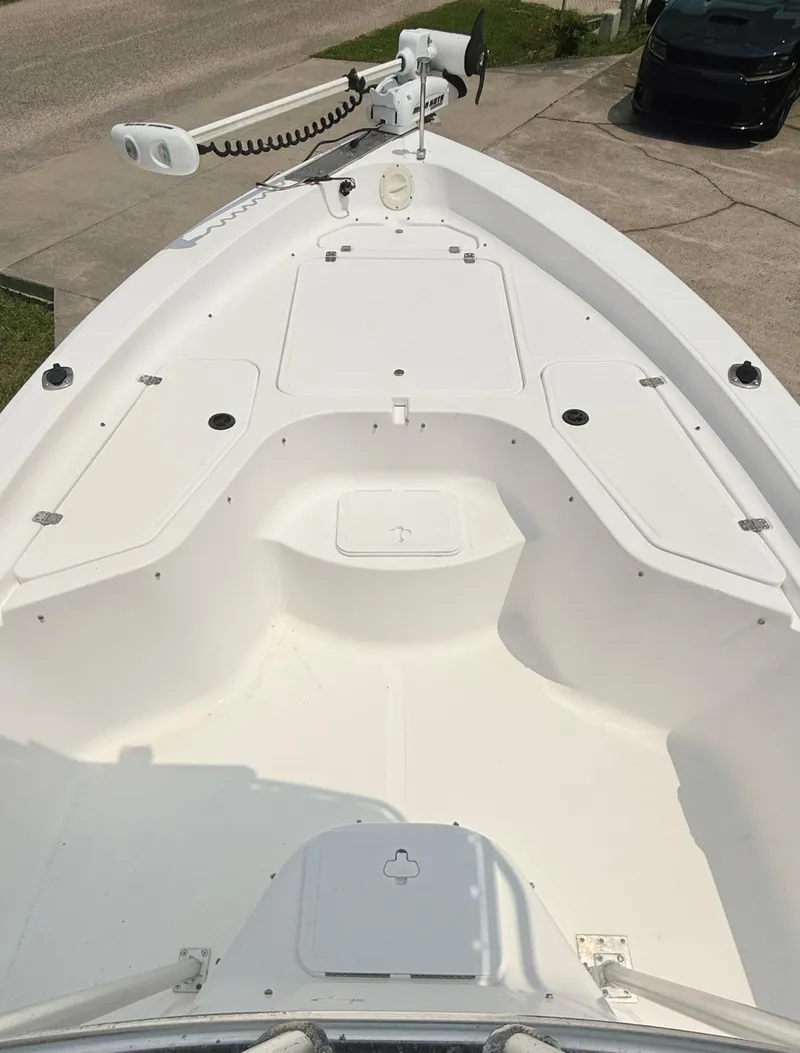 Slide: The Image of 2005 Sea Fox 245 Bay Fisher boat deck, featuring spacious storage and sleek design. - 4