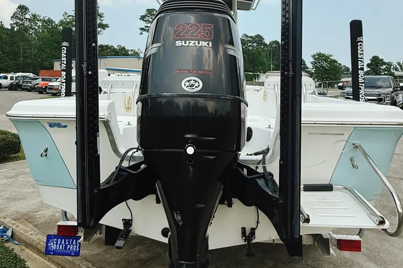 Slide: The Image of 2005 Sea Fox 245 Bay Fisher with Suzuki 225 outboard motor, parked on a trailer. - 5