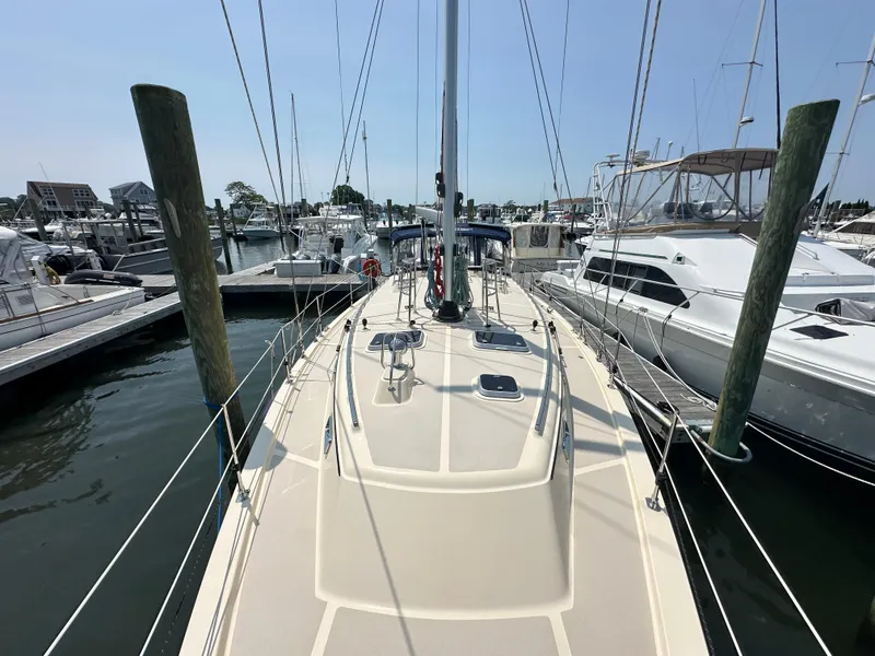 Slide: The Image of Island Packet 439 sailboat docked at marina, 2021 model, sunny day. - 11