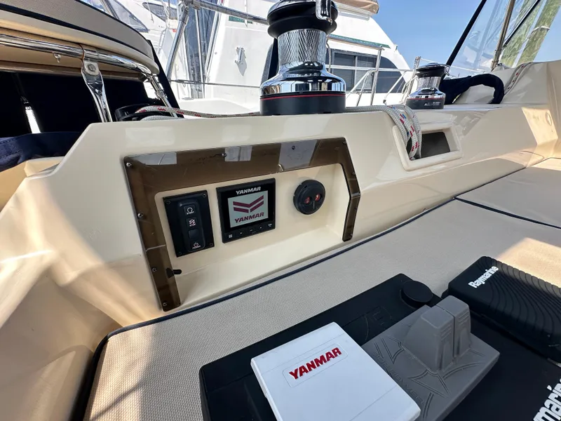 Slide: The Image of Island Packet 439 yacht cockpit with Yanmar controls, winches, and navigation equipment, 2021 model. - 20