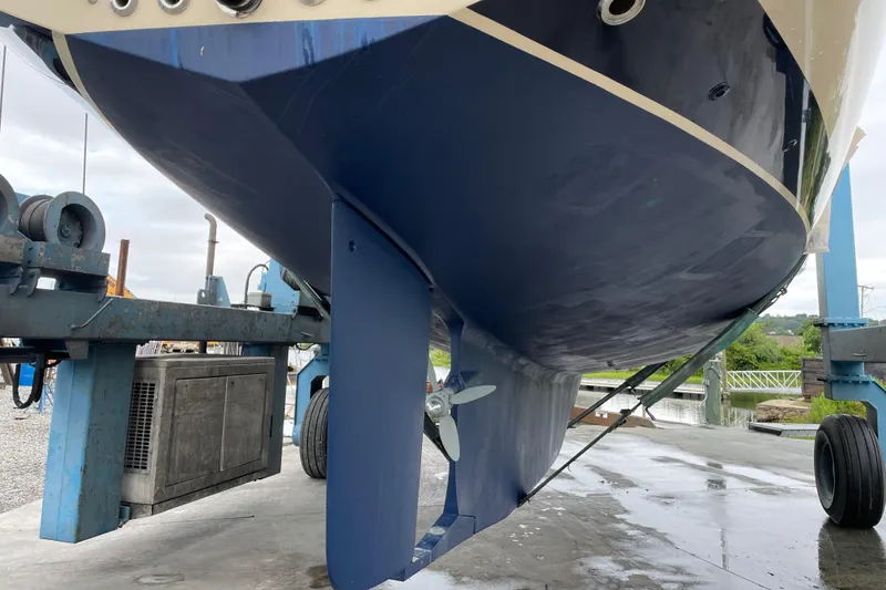 Slide: The Image of 2021 Island Packet 439 sailboat hull and propeller in dry dock. - 3