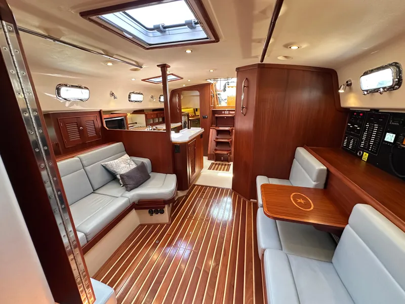Slide: The Image of Luxurious interior of 2021 Island Packet 439 yacht with elegant wood finishes and comfortable seating. - 46