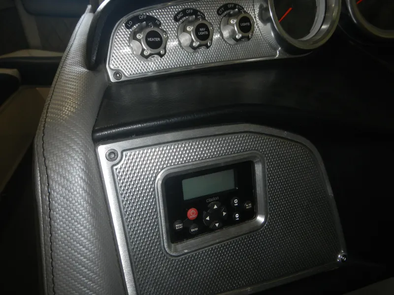 Slide: The Image of Dashboard controls of a 2013 MasterCraft X30 boat, featuring dials and a digital display. - 13
