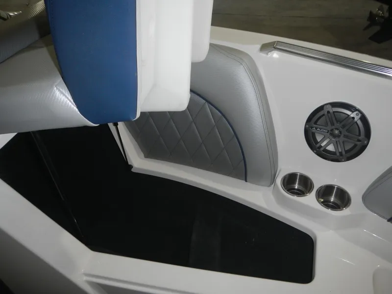 Slide: The Image of Interior of 2013 MasterCraft X30 boat with speaker and cup holders. - 26