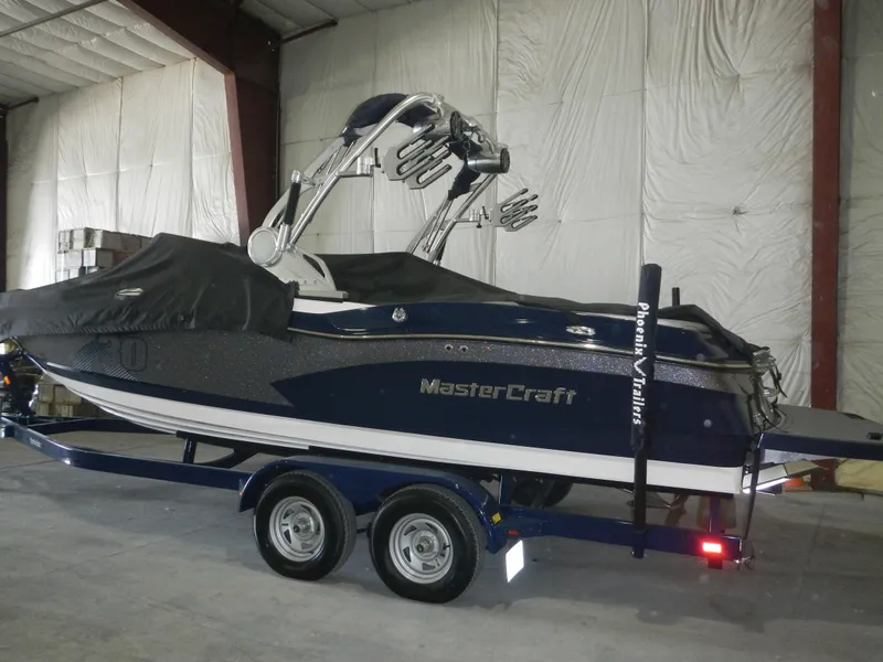 Slide: The Image of 2013 MasterCraft X30 boat on trailer in indoor storage. - 4
