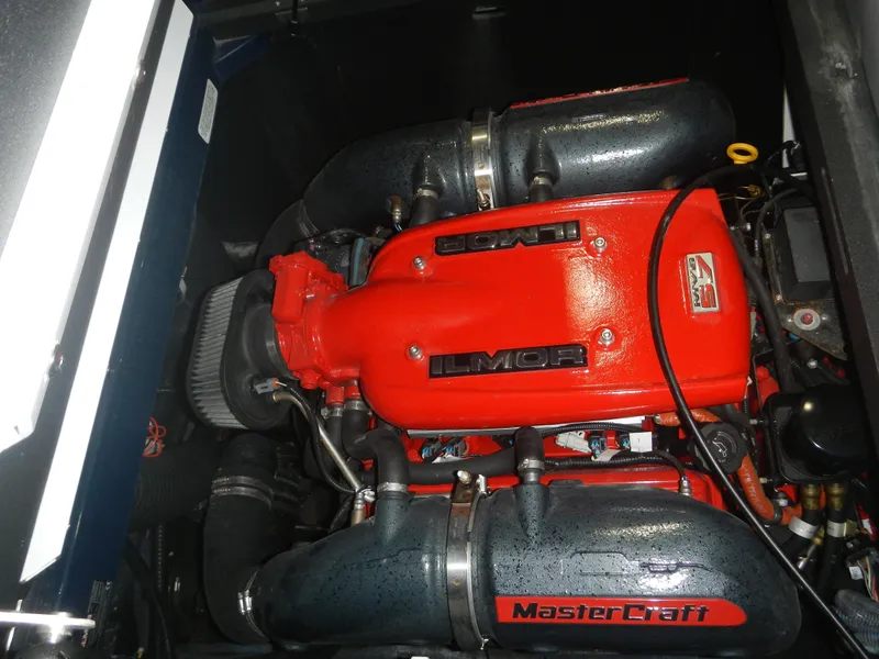 Slide: The Image of 2013 MasterCraft X30 engine with red Ilmor branding and black components. - 5