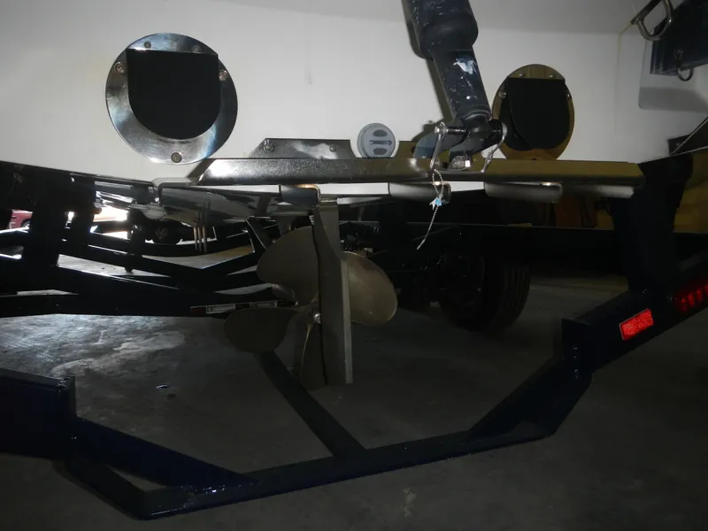 Slide: The Image of 2013 MasterCraft X30 boat propeller and trailer in a garage setting. - 9