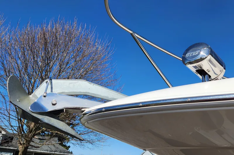 Slide: The Image of 2005 Regal Commodore 2765 boat anchor and bow against clear blue sky. - 14