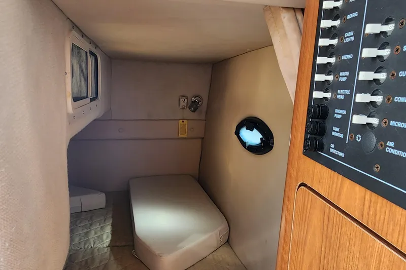 Slide: The Image of 2005 Regal Commodore 2765 cabin interior with control panel and small window. - 26