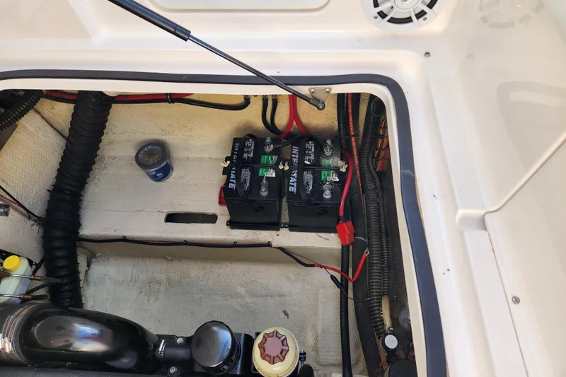 Slide: The Image of 2005 Regal Commodore 2765 boat engine compartment with batteries and wiring. - 30