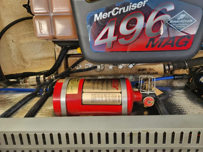 Slide: The Image of Engine compartment of 2005 Regal Commodore 2765 with MerCruiser 496 MAG and fire extinguisher. - 31