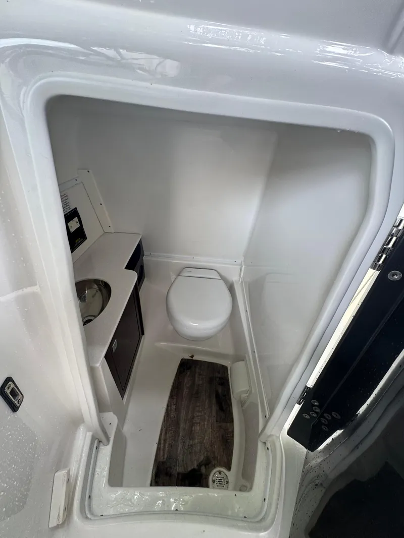 Slide: The Image of Compact bathroom in 2020 Monterey M65 boat with toilet and sink. - 14