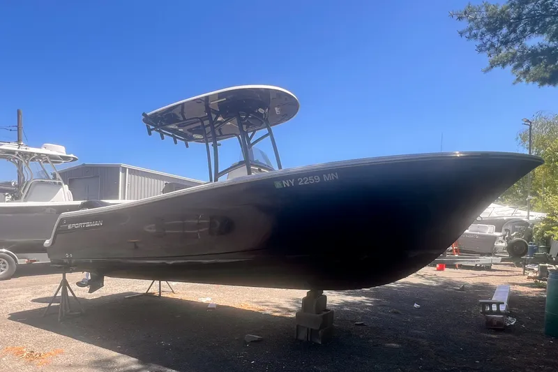 The Image of 2018 Sportsman Open 232 Center Console boat on display outdoors. - 0
