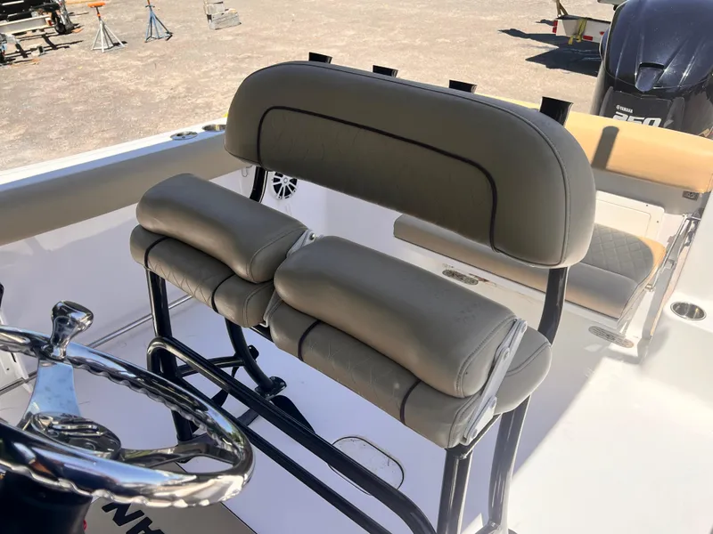 Slide: The Image of 2018 Sportsman Open 232 Center Console boat seating and steering wheel. - 3