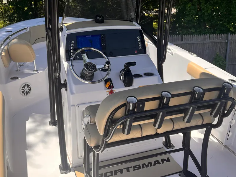 Slide: The Image of 2018 Sportsman Open 232 Center Console boat interior with steering wheel and seating. - 7
