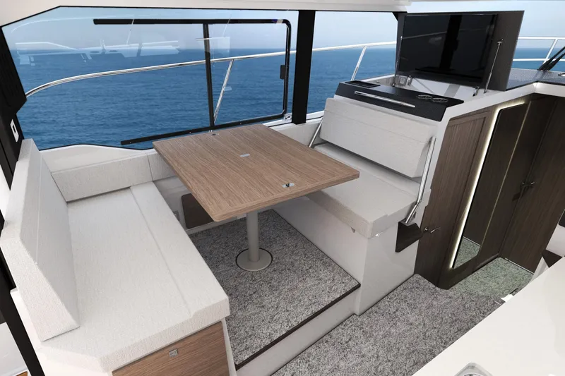 Slide: The Image of Interior of 2026 Jeanneau NC 1095 FLY S2 yacht with dining area and ocean view. - 4
