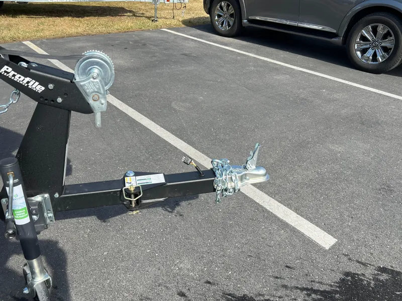 Slide: The Image of Trailer hitch of a 2025 Crestliner 1650 Kodiak in a parking lot. - 8