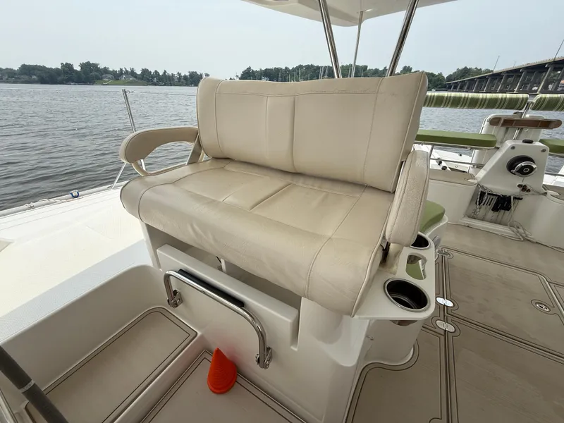 Slide: The Image of Luxury seating on 2021 Antares 44GS yacht, overlooking serene waters. - 11