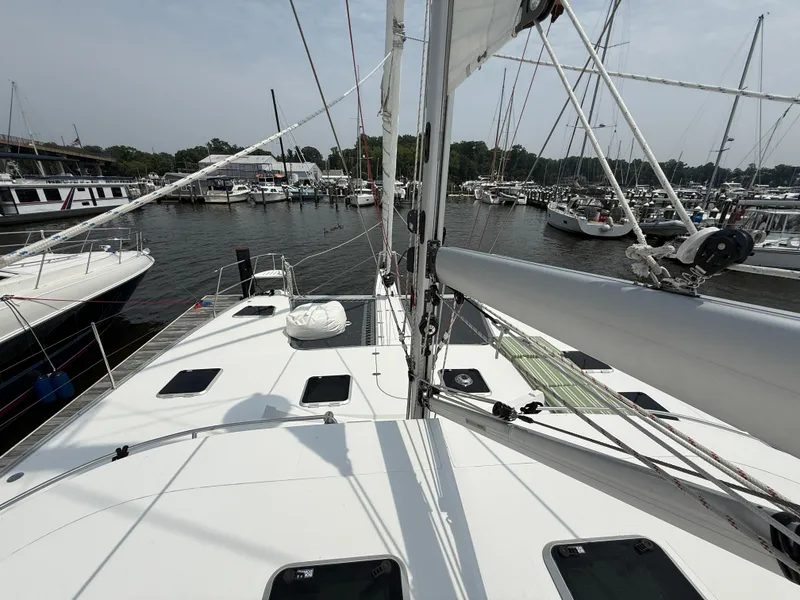 Slide: The Image of Sailing yacht Antares 44GS, 2021 model, docked in a marina with other boats. - 20
