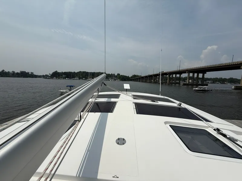 Slide: The Image of Sailing on Antares 44GS yacht, 2021 model, near a bridge on a calm river. - 21
