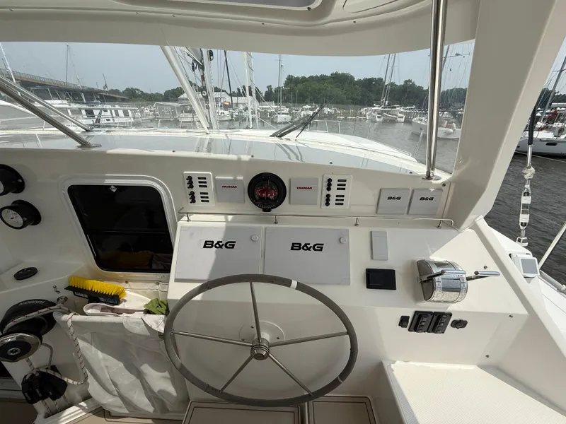 Slide: The Image of Cockpit of 2021 Antares 44GS yacht with steering wheel and navigation instruments. - 32