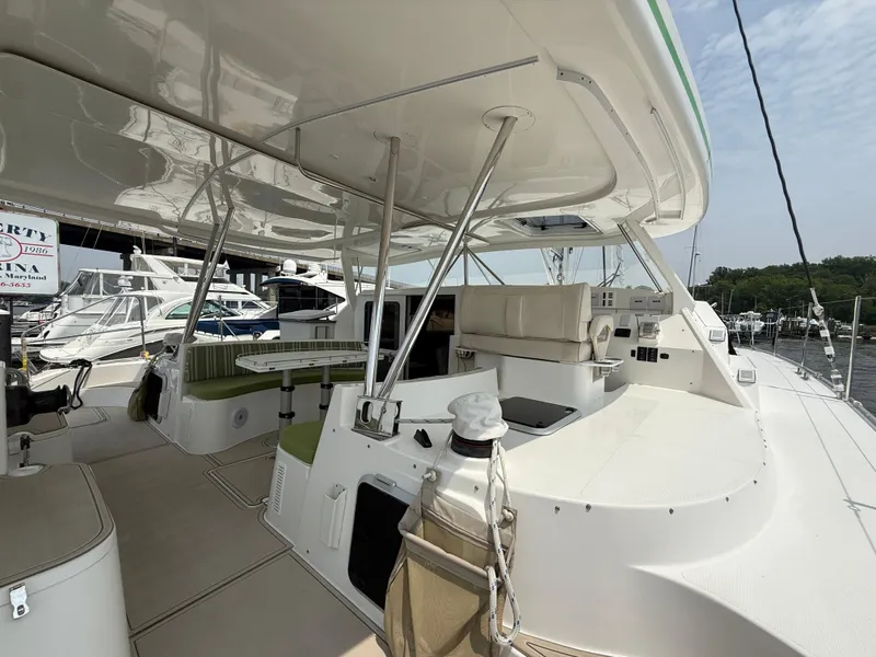 Slide: The Image of 2021 Antares 44GS yacht interior with seating and helm, docked at marina. - 34