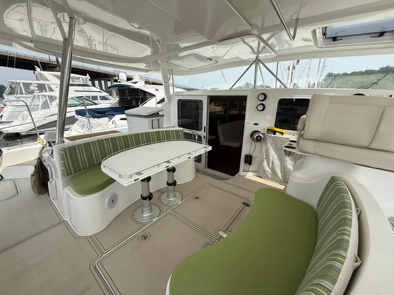 Slide: The Image of Spacious 2021 Antares 44GS yacht cockpit with green seating and white table. - 37