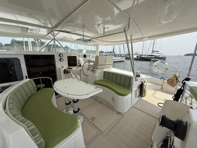 Slide: The Image of Spacious cockpit of 2021 Antares 44GS yacht with green seating and navigation equipment. - 39