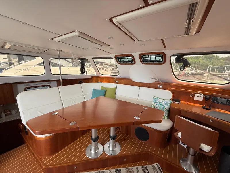 Slide: The Image of Luxurious interior of 2021 Antares 44GS yacht with elegant seating and wooden finishes. - 44