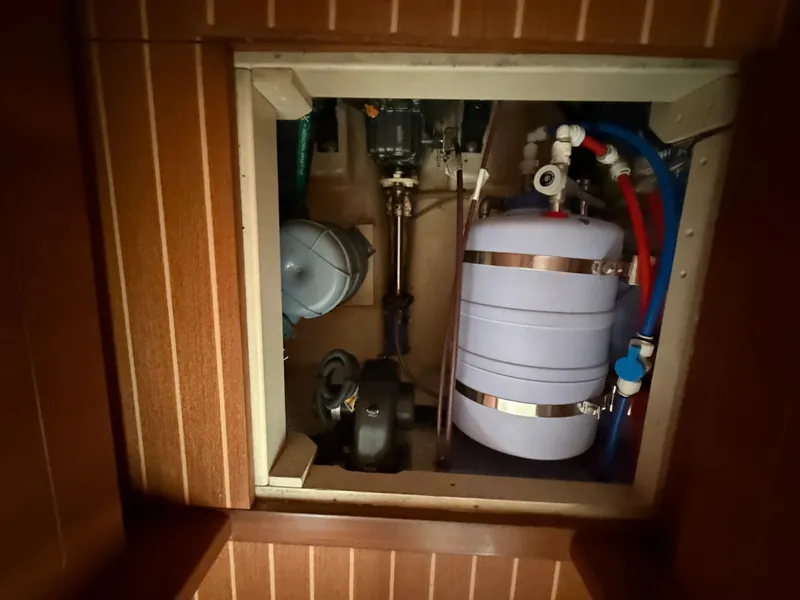 Slide: The Image of Engine compartment of 2021 Antares 44GS yacht, featuring mechanical and plumbing components. - 48