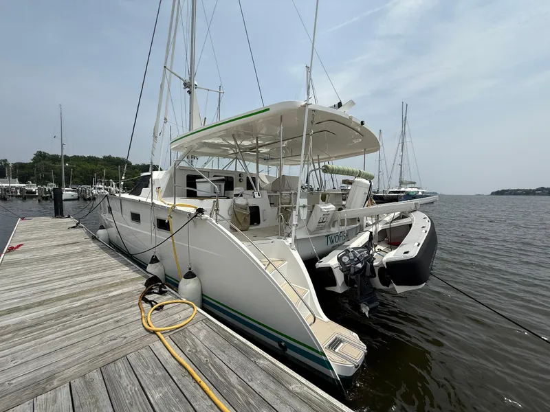 Slide: The Image of 2021 Antares 44GS catamaran docked at a marina, rear view. - 5