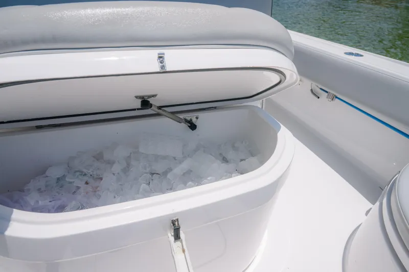 Slide: The Image of Open cooler with ice on 2024 Contender 26 Bay boat deck. - 12