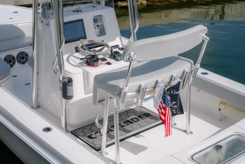 Slide: The Image of 2024 Contender 26 Bay boat interior with steering console and seating. - 15