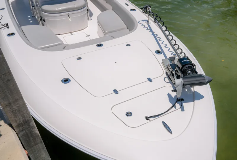 Slide: The Image of 2024 Contender 26 Bay boat with sleek design and advanced trolling motor. - 22
