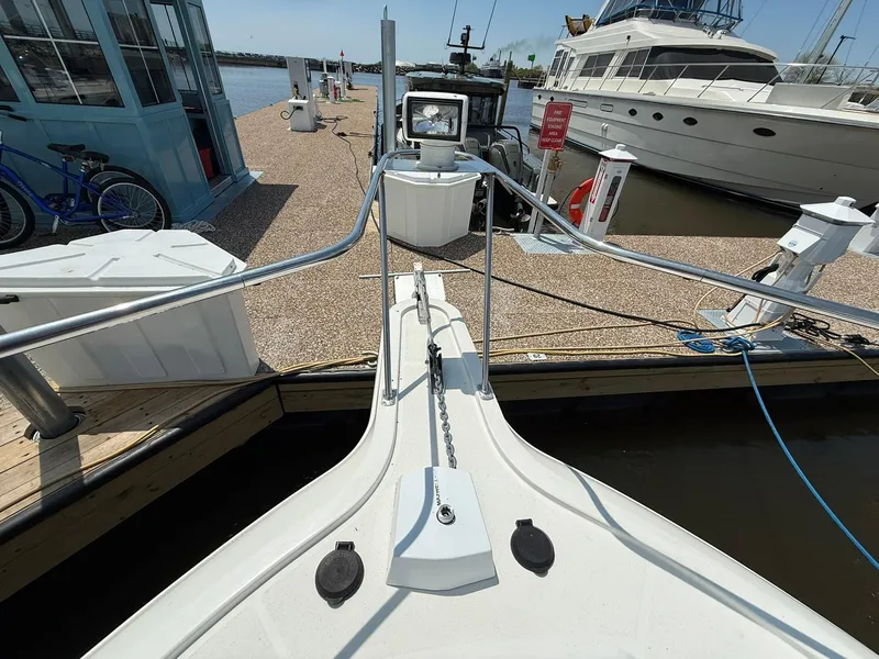 Slide: The Image of 1996 Carver 325 Aft Cabin yacht docked at marina, view from bow. - 12