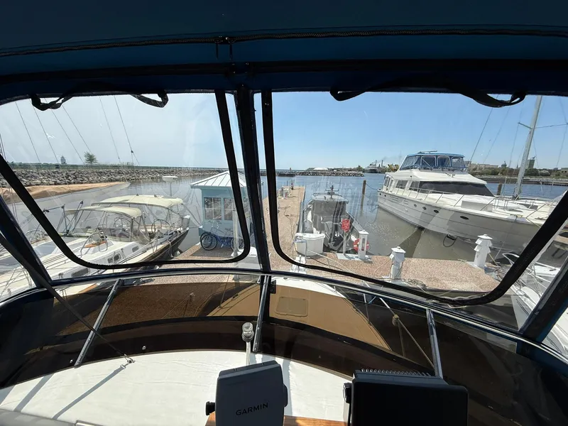 Slide: The Image of 1996 Carver 325 Aft Cabin yacht docked at marina, view from helm. - 27