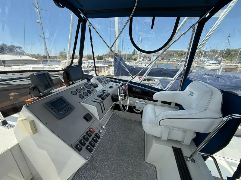 Slide: The Image of 1996 Carver 325 Aft Cabin helm with modern controls and comfortable seating. - 29