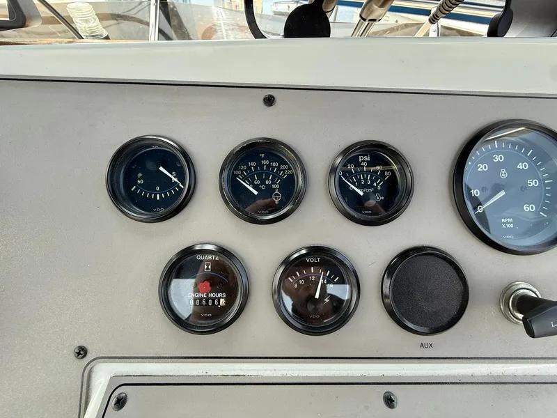 Slide: The Image of Instrument panel of a 1996 Carver 325 Aft Cabin boat, featuring various gauges. - 30