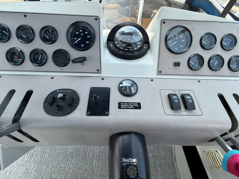 Slide: The Image of 1996 Carver 325 Aft Cabin dashboard with gauges and controls. - 33