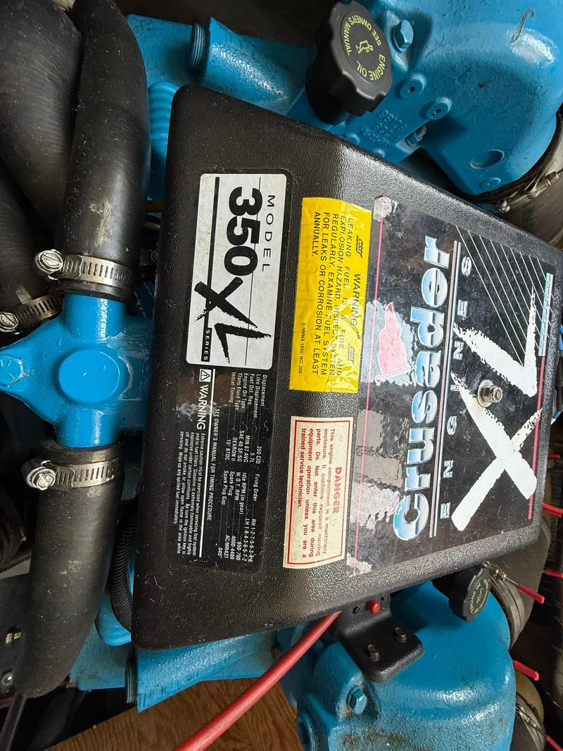 Slide: The Image of Engine of a 1996 Carver 325 Aft Cabin, featuring a Crusader 350 XL model. - 39